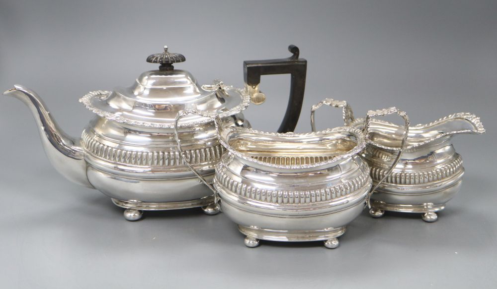 An Edwardian silver three piece tea set by Nathan & Hayes, Chester, 1904/5/6